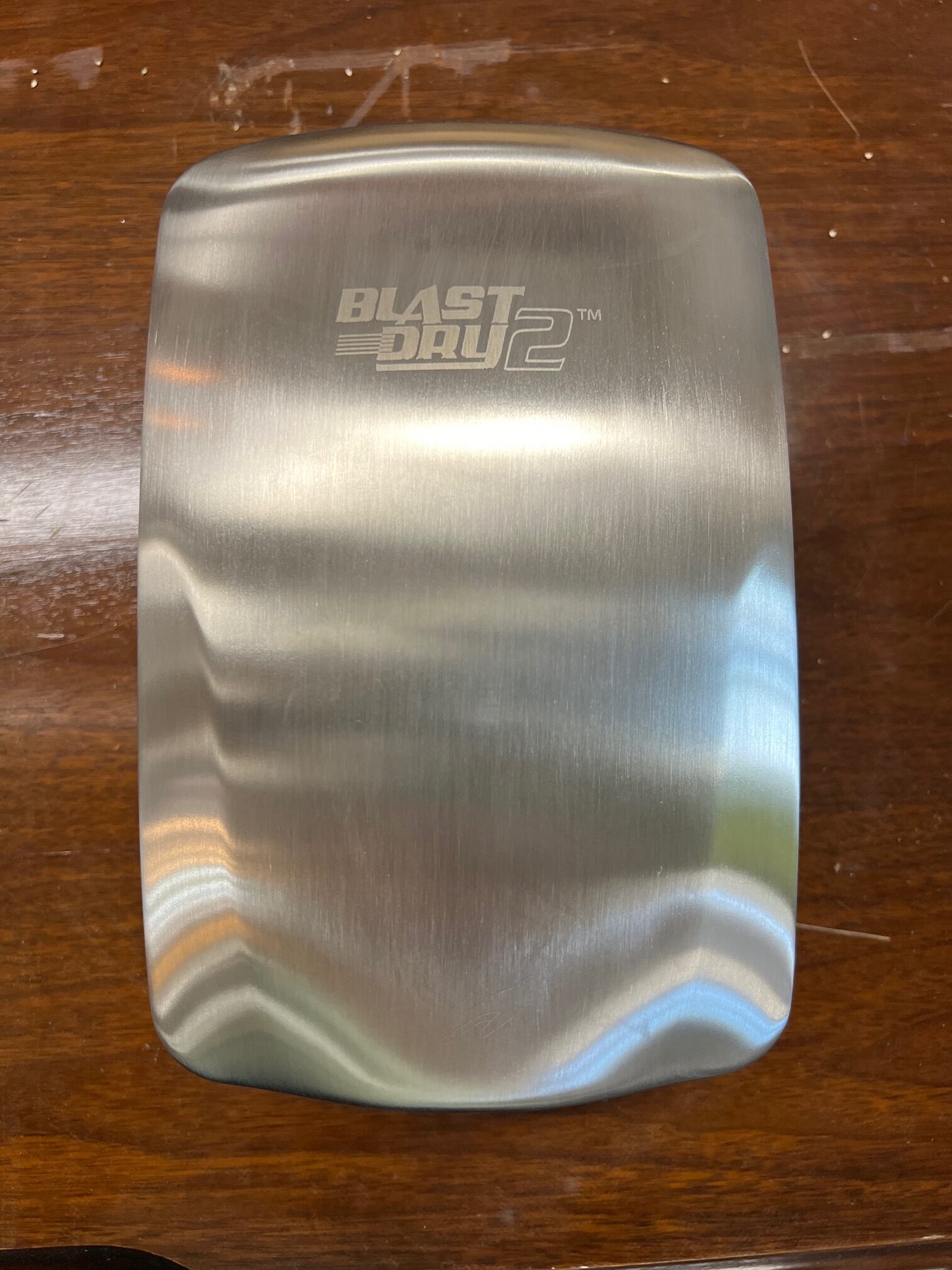 A stainless steel Blast Dry 2 hand dryer, salvaged by Building Value for repurposing.