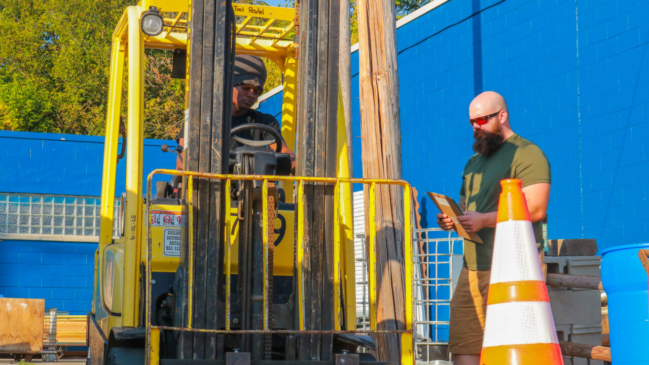 Construction Training Program instructor, Stephen Berkey, teaches trainees how to drive a forklift - Photo by Elijah McKenzie Construction Training Program instructor, Stephen Berkey, teaches trainees how to drive a forklift - Photo by Elijah McKenzie