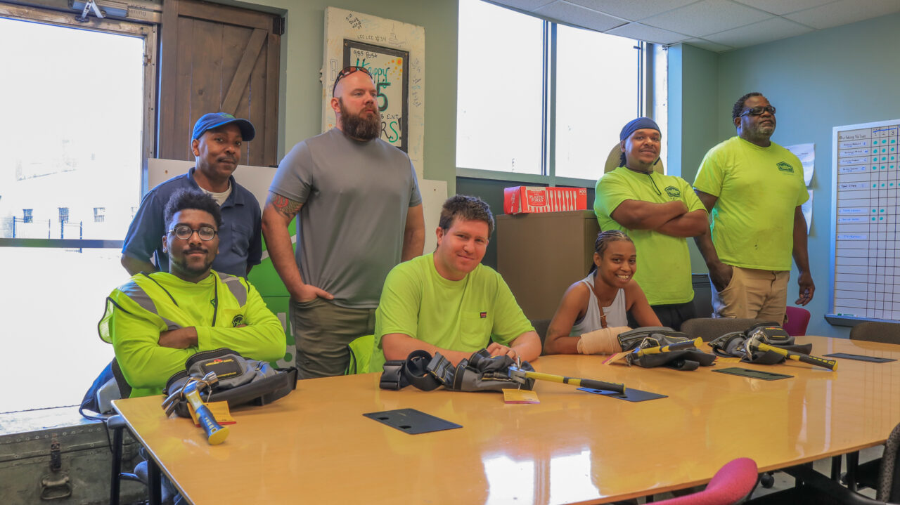 Members of the Building Value Construction Training Program celebrate their graduation. - Photo by Elijah McKenzie Members of the Building Value Construction Training Program celebrate their graduation. - Photo by Elijah McKenzie